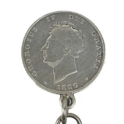 Lot 74 - Three silver Albert watch chains and a gold-plated watch chain with Guinea games token fob.