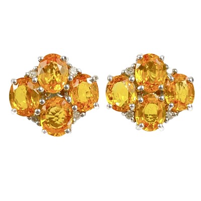 Lot 129 - A pair of modern 9ct white gold yellow sapphire and diamond set stud earrings by Rocks & Co.