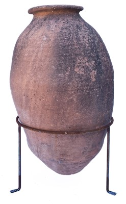 Lot 368 - A terracotta olive jar.