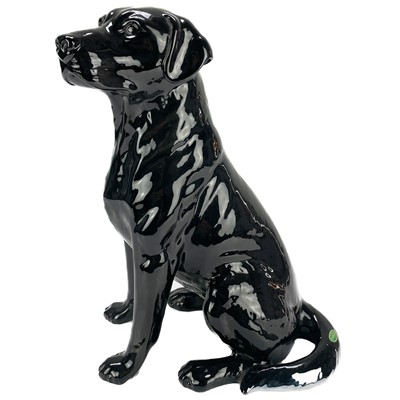 Lot 506 - A Beswick fireside seated black Labrador.