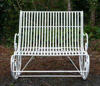 Lot 369 - A wrought iron two seater garden rocking chair.