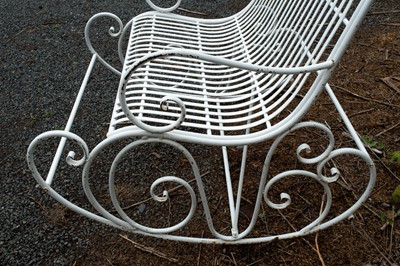 Lot 369 - A wrought iron two seater garden rocking chair.