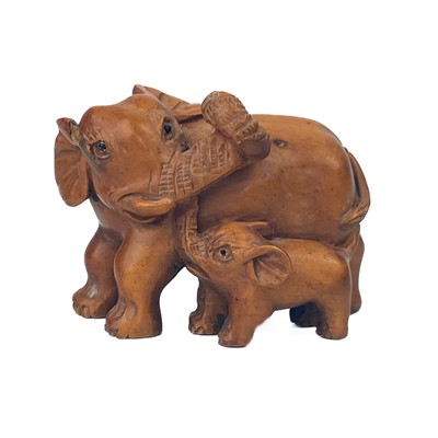 Lot 1281 - A Japanese carved wood netsuke of an elephant and her calf, signed.