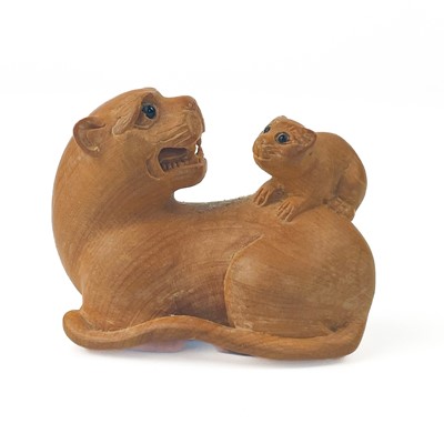 Lot 321 - A Japanese carved wood netsuke