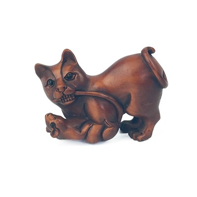 Lot 350 - A Japanese carved wood netsuke of a cat playing with a mouse, signed.