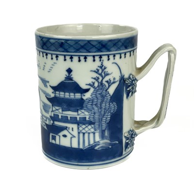 Lot 1265 - A Chinese blue and white porcelain tankard, 18th century.