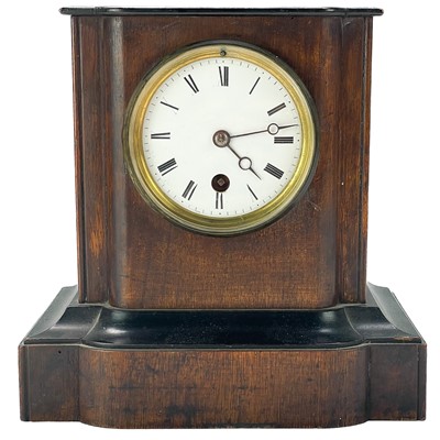 Lot 329 - A French walnut cased mantel timepiece.