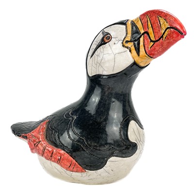 Lot 557 - A Jennie Hale Raku glazed figure of a puffin.