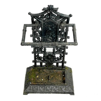 Lot 56 - A Victorian Aesthetic movement cast iron stick stand.
