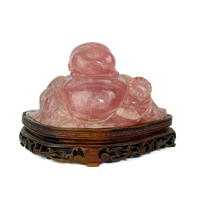 Lot 1196 - A Chinese rose quartz model of buddha.