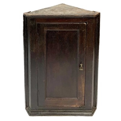 Lot 67 - A Georgian oak corner cupboard.