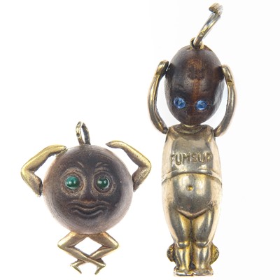 Lot 264 - Two silver and wood 'FUMSUP' and 'TOUCH WUD' charms.