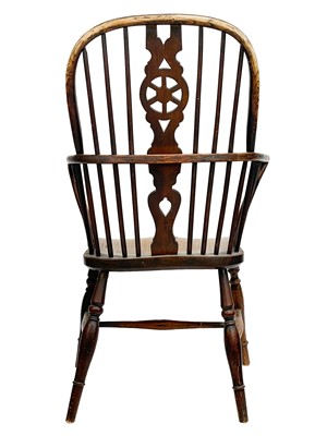 Lot 246 - An ash and fruitwood wheelback Windsor armchair.