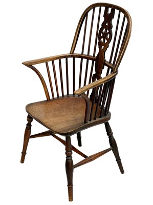 Lot 246 - An ash and fruitwood wheelback Windsor armchair.