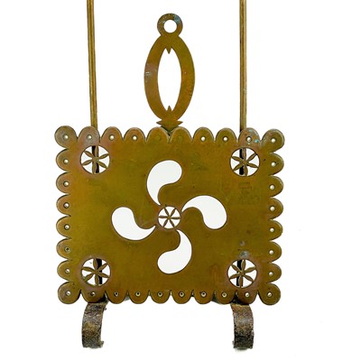 Lot 204 - A Victorian brass sliding trivet.