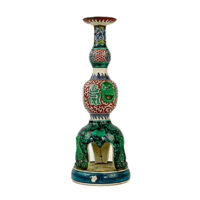 Lot 242 - A Japanese Ao de Kutani candlestick, late 19th century.