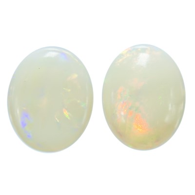 Lot 170 - Two loose oval cabochon white opals.