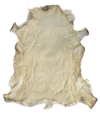 Lot 34 - A Pokka reindeer hide rug.