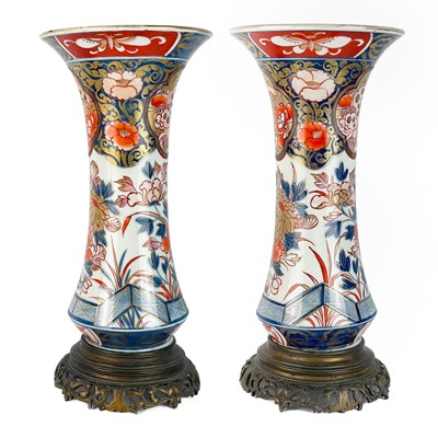 Lot 1195 - A pair of Japanese Imari trumpet vases, Meiji period.