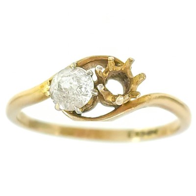 Lot 182 - A 9ct rose gold crossover ring set with a low grade diamond.