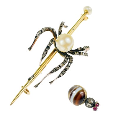 Lot 186 - A Victorian gold diamond and pearl set spider bar brooch.