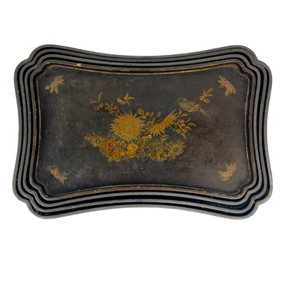 Lot 307 - A set of four Japanned lacquered graduated trays, early 20th century.