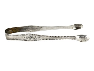 Lot 6 - A pair of George III Newcastle silver sugar tongs.