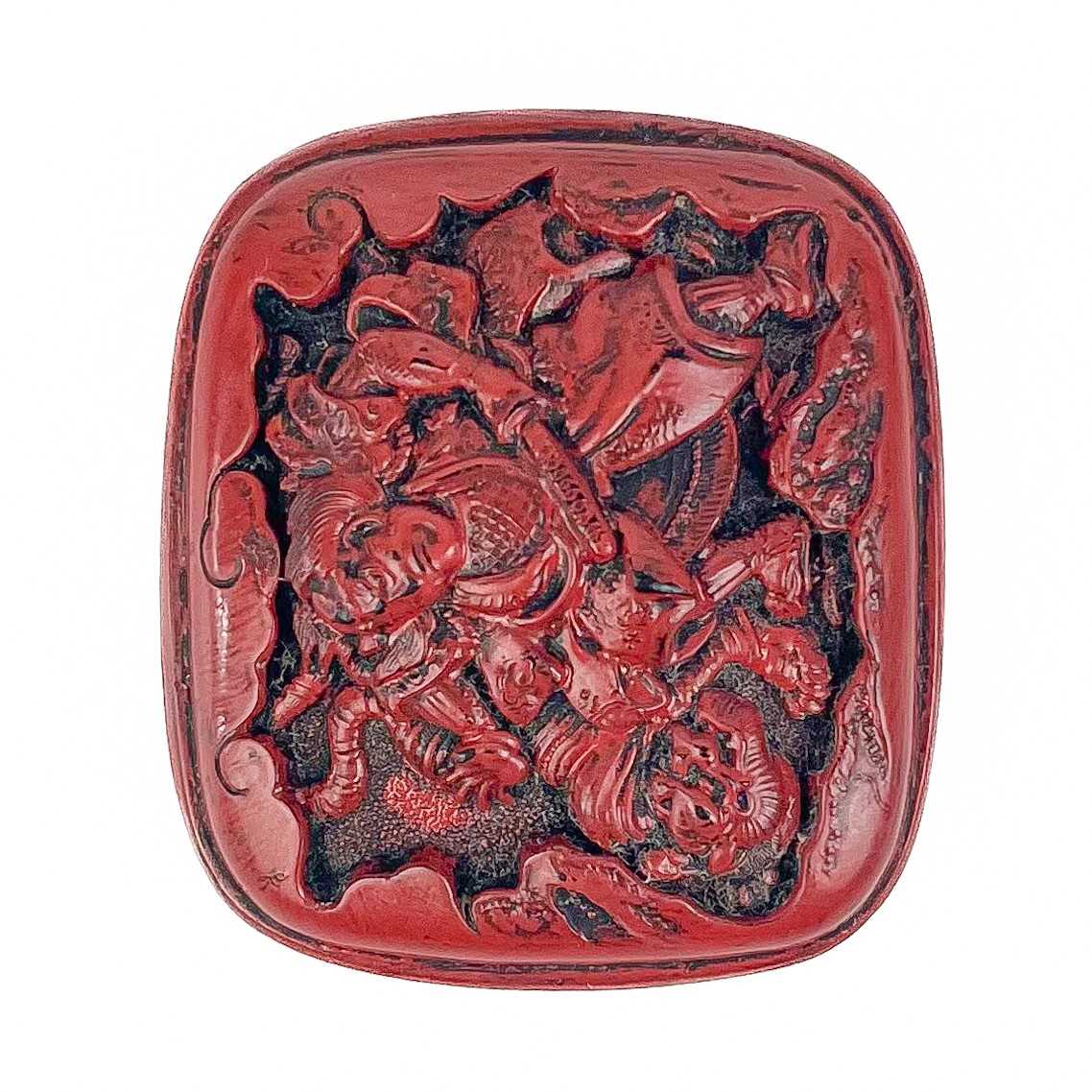 Lot 1088 - A Japanese cinnabar lacquer netsuke.