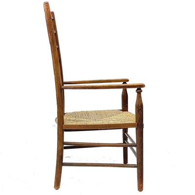 Lot 647 - A beech ladderback nursing chair labelled Liberty.