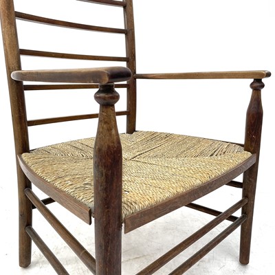 Lot 647 - A beech ladderback nursing chair labelled Liberty.