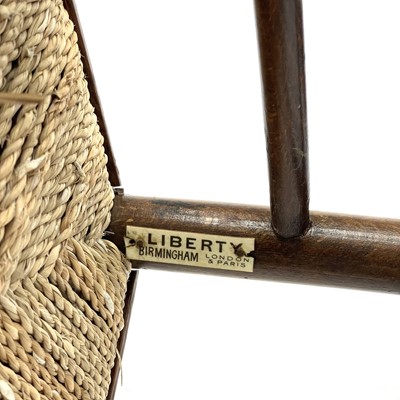 Lot 647 - A beech ladderback nursing chair labelled Liberty.