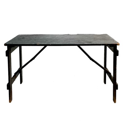 Lot 62 - A folding pine trestle table.