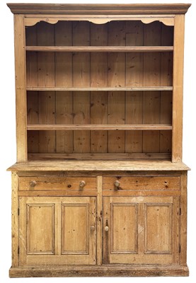 Lot 68 - A late Victorian pine kitchen dresser.