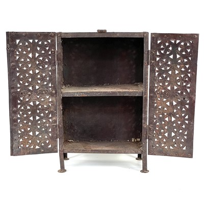 Lot 136 - An Islamic pierced iron cabinet.