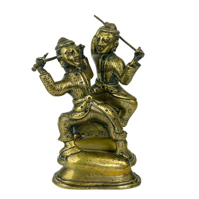 Lot 375 - A Pair of Tibetan polished bronze warriors, 19th century.