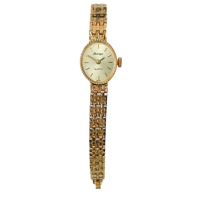 Lot 123 - A 9ct gold lady's quartz bracelet wristwatch.