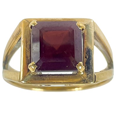 Lot 203 - A 9ct garnet set dress ring.