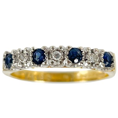 Lot 207 - An 18ct diamond and sapphire seven stone ring.