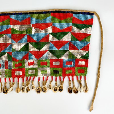 Lot 157 - An Angolan beadwork and cowrie shell apron, early 20th century.