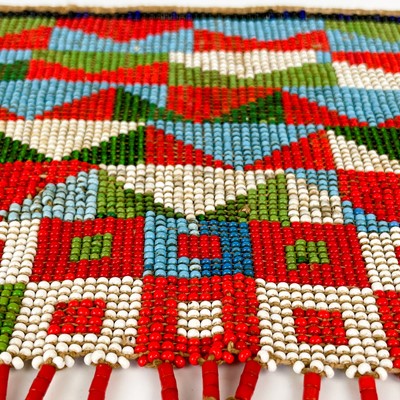 Lot 157 - An Angolan beadwork and cowrie shell apron, early 20th century.
