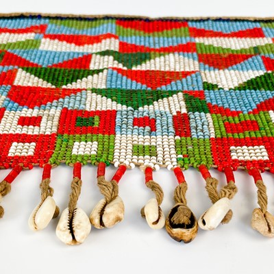 Lot 157 - An Angolan beadwork and cowrie shell apron, early 20th century.