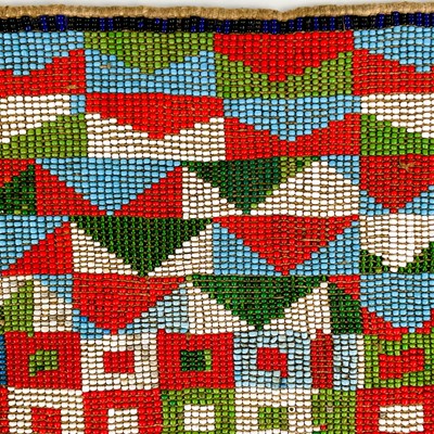 Lot 157 - An Angolan beadwork and cowrie shell apron, early 20th century.