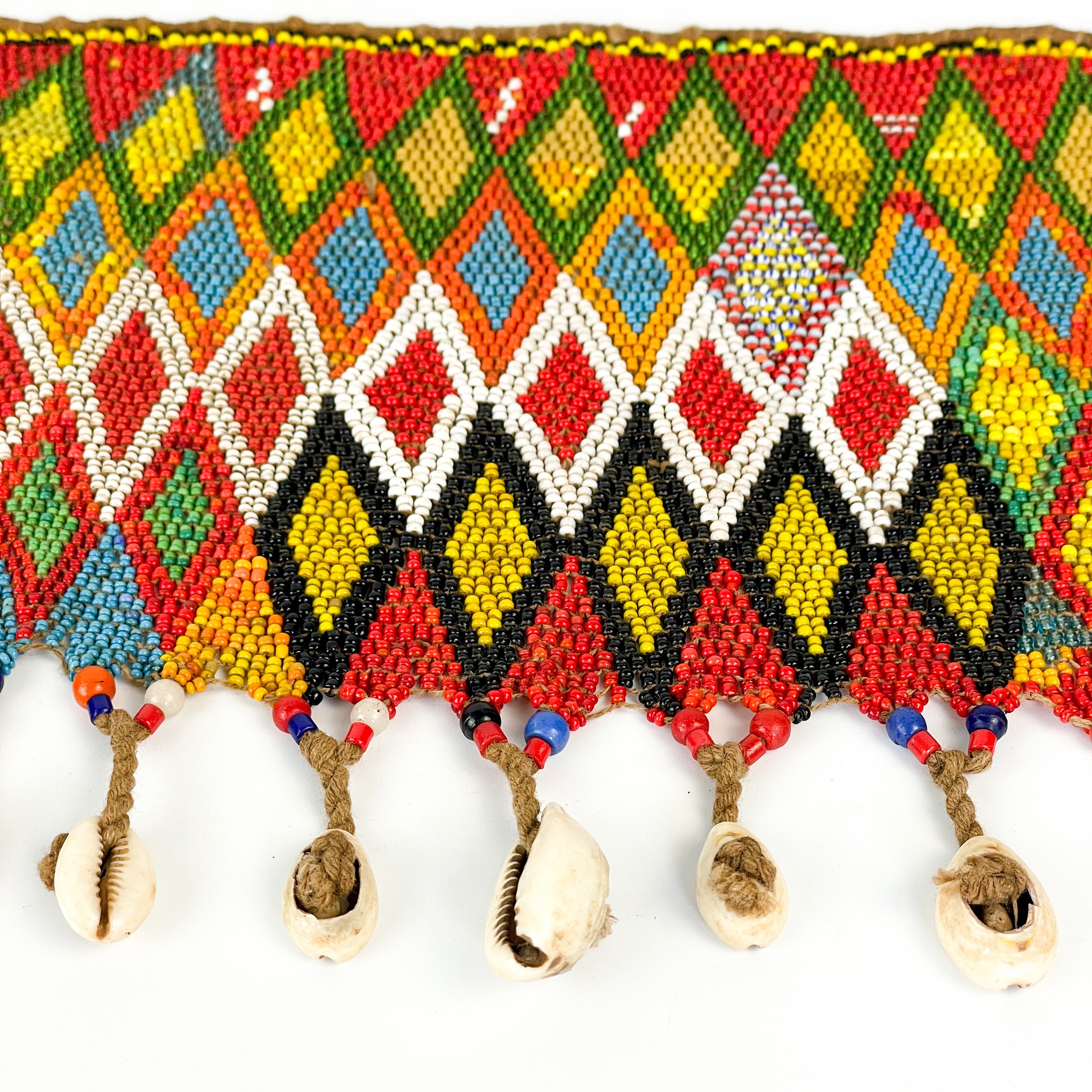 Lot 159 - An Angolan beadwork and cowrie shell apron,
