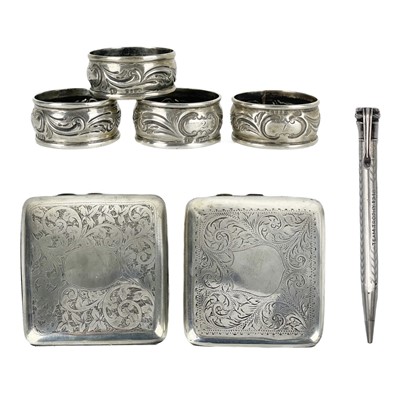 Lot 3 - Two silver cigarette cases, a propelling pencil and four napkin rings.