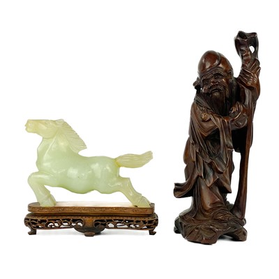 Lot 398 - A Chinese model of a jade horse on stand, 20th century.