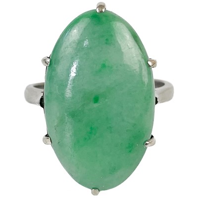 Lot 1242 - An 18ct white gold and platinum jade ring.