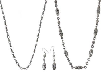 Lot 523 - A heavy silver bead necklace and matching earrings.