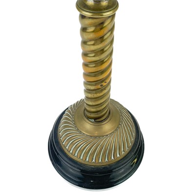 Lot 14 - A Victorian brass oil lamp with a brass oil reservoir and an etched orange glass shade.