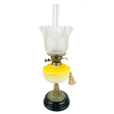 Lot 3 - A Victorian brass oil lamp with moulded yellow glass reservoir and etched glass shade.