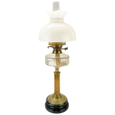 Lot 31 - A Victorian brass oil lamp with a glass reservoir and white glass shade.